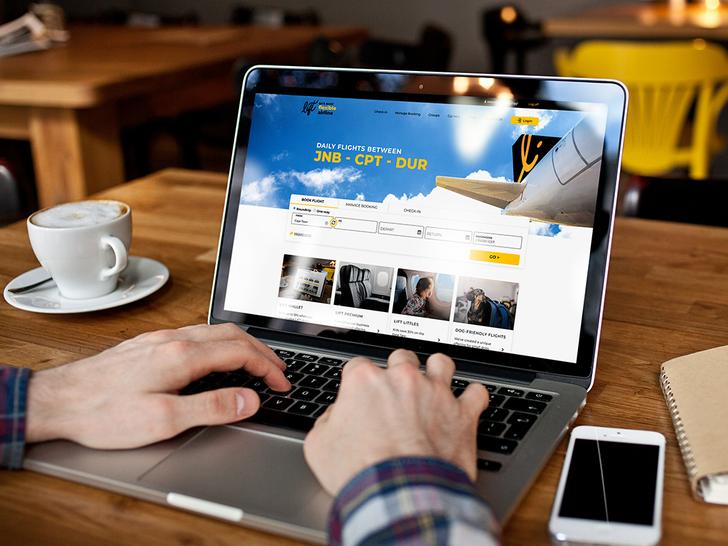 Person using laptop to manage their LIFT flight booking online.
