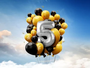 Balloon cluster with a large number five celebrating LIFT’s fifth birthday.